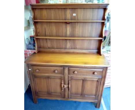An Ercol medium oak dresser
