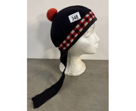 A Scottish tartan Balmoral bonnet pipe band hat