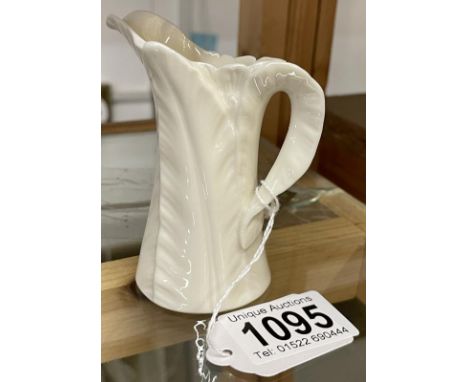 A small Royal Worcester porcelain cream jug.