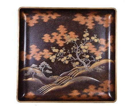 A Japanese Lacquer Bon (Robe Tray), of rounded rectangular form decorated with pines and a prunus tree on the hilly banks of 