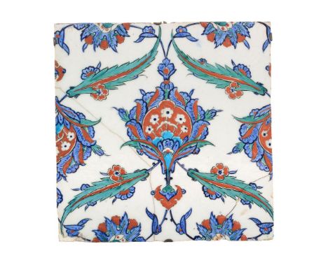A large Iznik polychrome glazed fritware tile, Ottoman Turkey, circa 1575, of square form with central floral medallion in 's
