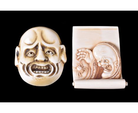 ϒ A Japanese Ivory Netsuke in the form of a partially opened kakejiku upon which is depicted Yamauba and the spider, the reve