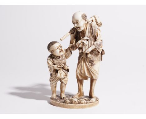 A Japanese ivory okimono of a man and boy, both standing, the man carrying an axe and hare, signed, 15cm high.