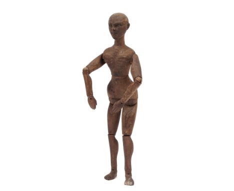 An artist's beechwood lay figure or mannequin, early 20th century, with jointed head, body and limbs, 33cm. 