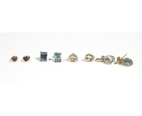 A pair of 18ct gold and aquamarine pendant earrings, the oval-cut aquamarines suspended from lozenge shaped studs; a pair of 