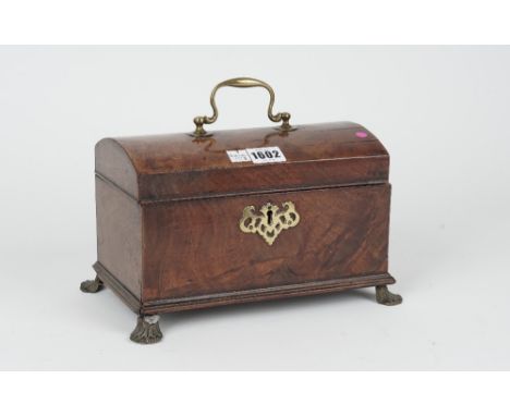 A mid-18th century mahogany dome top tea caddy on gilt metal paw feet, 27cm wide x 16cm high. 