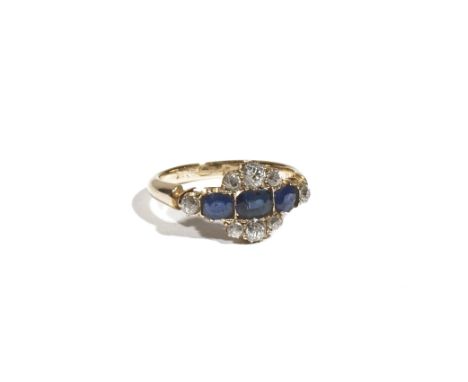 An 18ct gold, sapphire and diamond-set dress ring, set with three oval-cut sapphires, between six old mine-cut diamonds, set 
