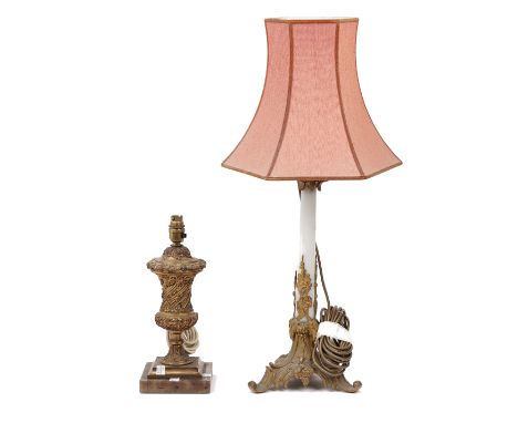A Victorian style gilt metal and faux marble mounted table lamp, on a foliate cast triform base and a gilt metal urn form tab
