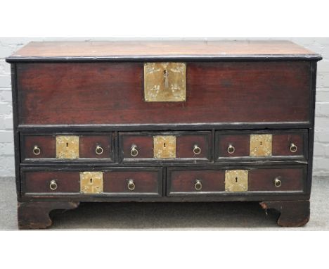 A 19th century Indian brass mounted teak mule chest, the lift top over five drawers on bracket feet, 138cm wide x 80cm high. 