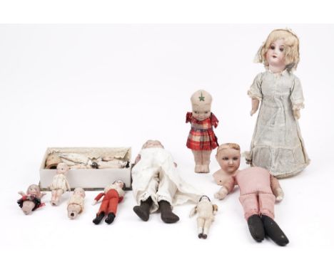 A quantity of early 20th century porcelain dolls, including Armand Marseille, Kewpie and small miniatures, (qty)