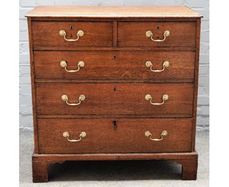 A George III oak chest, with two short over three long graduated drawers on bracket feet, 92cm wide x 95cm high. 