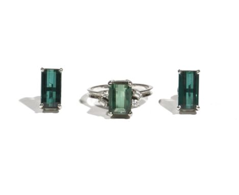 A green tourmaline and diamond-set dress ring, the rectangular cut-cornered step-cut tourmaline four claw-set with circular a