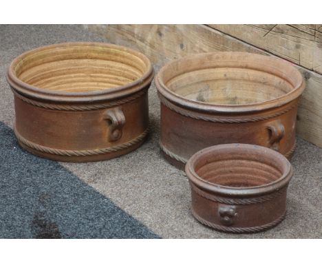 Pair terracotta planters with handles (D42cm), and similar smaller planter 