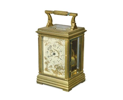A French brass repeating carriage clock, circa 1900,  the rectangular dial with Arabic numerals and decorated with raised gil