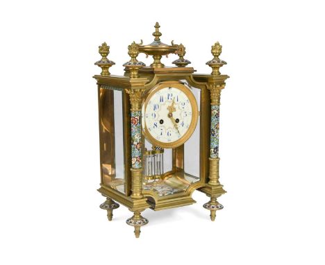 A French brass and enamelled mantel clock, late 19th century,  with four finials and central urn above painted dial, with Ara