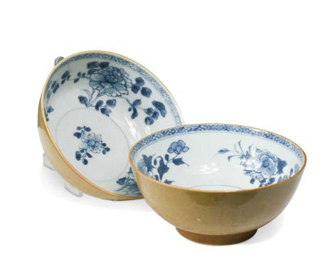 Two Chinese Nanking Cargo blue and white and cafe-au-lait bowls, circa 1750,  the interiors painted with sprays of peonies wi