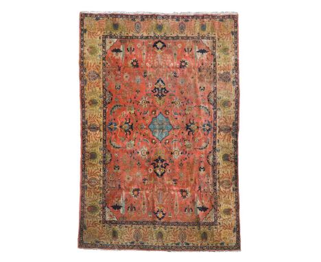 A Tabriz carpet, circa 1940, the terracotta field incorporating lotus flowers and animals within a soft jasmine border410 x 3