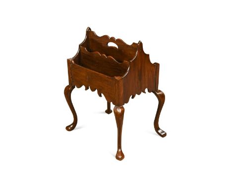 A Chippendale revival mahogany canterbury, late 19th/early 20th century, of unusual design with a central carrying handle and