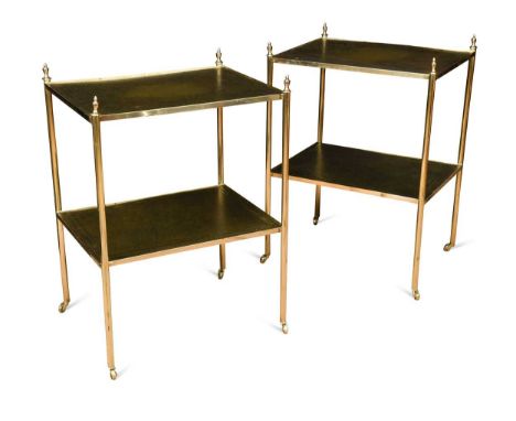 A pair of leather topped brass etageres, 20th century, each with two rectangular tiers on column supports with urn finials63.