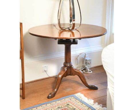 A George III mahogany circular tripod table, on birdcage support and pad feet70 x 89cm