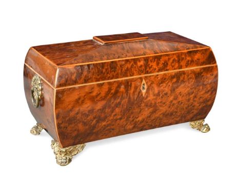 A Regency burr yew and inlaid bombe form sarcophagus tea caddy, with applied rosette carrying handles and pressed and moulded