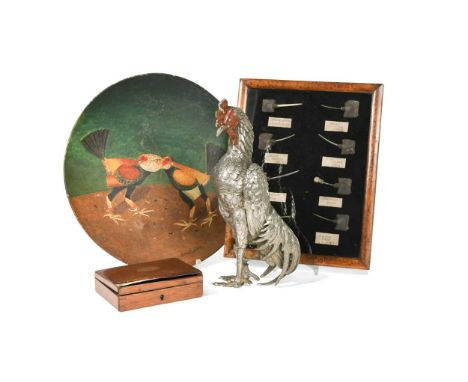Cockfighting Interest, a framed and glazed display of assorted spurs,   each labelled; together with a silvered metal model o