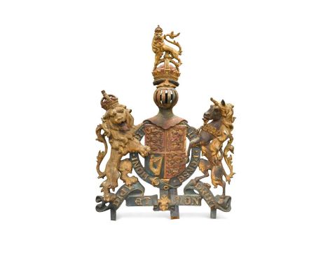 A large Victorian painted cast iron Royal coat of arms,  with later easel back stand131 x 90cmThere is a loss to the tip of t