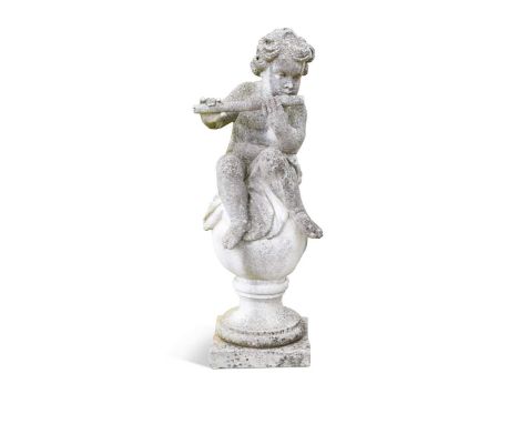 A reconstituted stone figure of Pan, 20th century, playing the flute seated on a ball97cm high