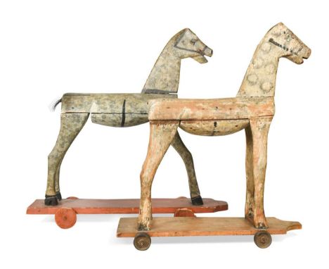 Two primitive painted model pull-along horses, late 19th/early 20th century, together with another painted pine and compositi