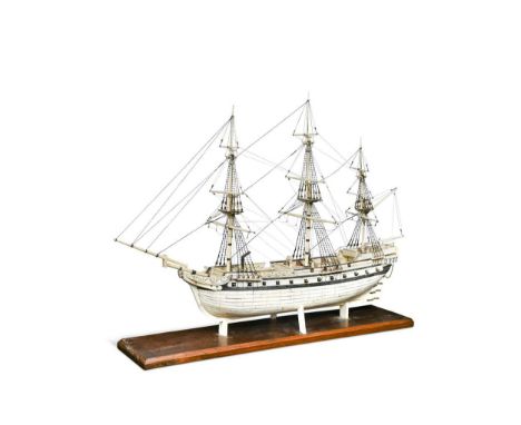 A Prisoner of War style bone model of a 32 gun ship, modern,  fully rigged and mounted to a hardwood plinth basethe ship 63cm