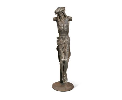 A lead model of the Crucifixion, possibly Southern German, late 17th century,  mounted to a later stand and base81cm high ove