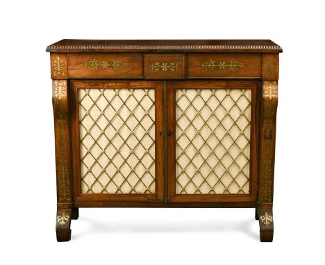 A Regency rosewood and brass inlaid side cabinet, the rectangular top with gadrooned edge over two frieze drawers and pair of