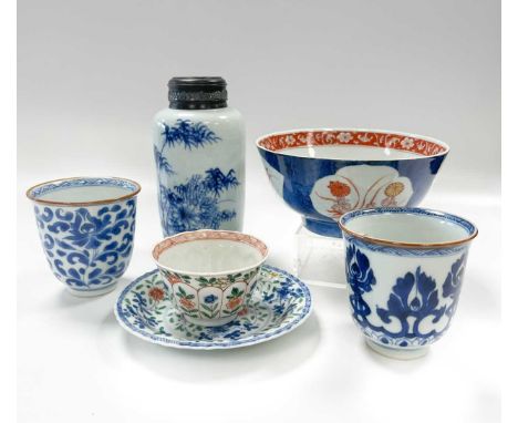 A Chinese powder blue ground bowl, Qing Dynasty, Kangxi Emperor, circa 1710, with reserves of fan-leaf shape enclosing rouge-