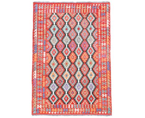 A contemporary hand-knotted wool kelim carpet, with a typical geometric design in bold colours300 x 207cmIn as new condition 