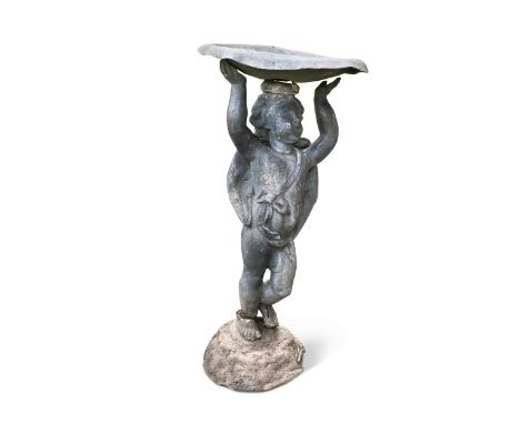 A small lead model garden cherub, supporting a dish top75cm high