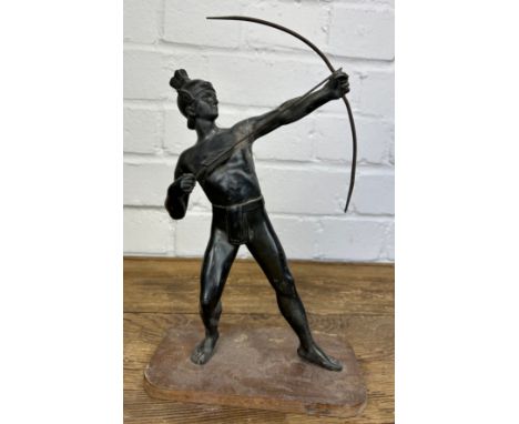 A CAST METAL SCULPTURE OF AN ARCHER WITH BOW AND ARROW, On wooden stand. 27cm H 