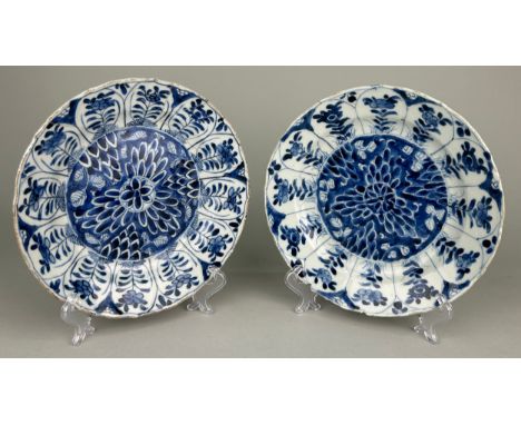 A PAIR OF 18TH CENTURY KANGXI PERIOD BLUE AND WHITE DISHES,Old repairs.20.5cm D