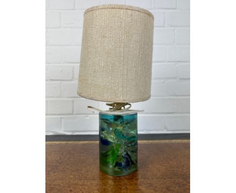 AN UNUSUAL GLASS OR RESIN TABLE LAMP, 14cm HWith hessian shade. 