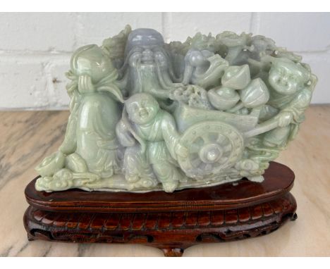 A CHINESE JADE GROUP ON ROSEWOOD STAND,Probably 20th Century or modern. Jade 20cm x 11cm 