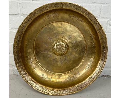 A LARGE OTTOMAN HAMMAM BASIN, Hand raised Tombak, metal inscribed with fish and symbols. 46cm x 9cm