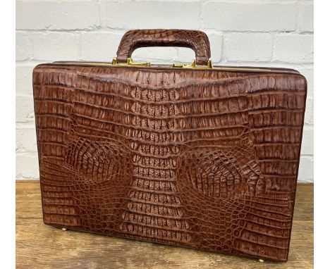 A CROCODILE SKIN BRIEFCASE BY PRESTO WITH GOLD COLOURED METAL HARDWARE, 45cm x 31cm x 8cm 