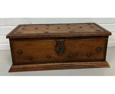 A ZANZIBAR WOODEN TRUNK WITH METAL STUDS AND HANDLES, 63cm x 29cm x 24cm 