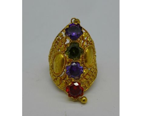 A yellow metal ring set with two amethysts, peridot and spinel, 8g, R