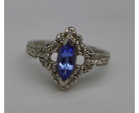 A 14ct white gold, tanzanite and fourteen diamond ring, 4.5g, R