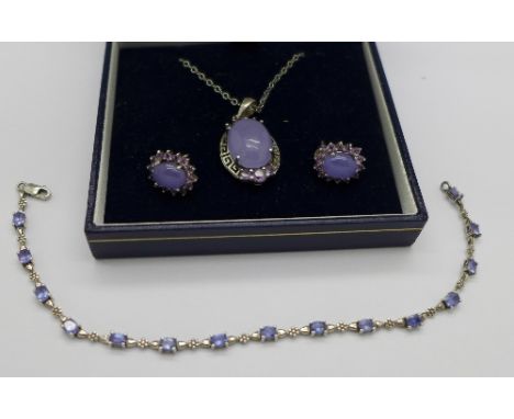 A silver and tanzanite bracelet and a silver mounted jade pendant with matching earrings