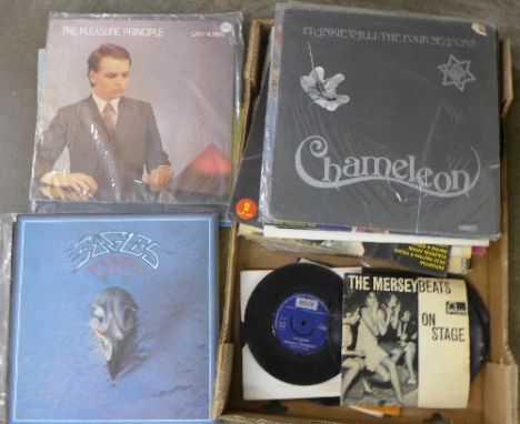 A collection of LP records and 7" singles, LP's include early Elvis Presley, Cat Stevens, Wings, etc.