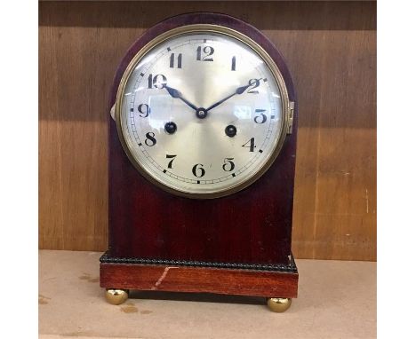 Antique mahogany mantel clock. Complete with pendulum &amp; key. Clock ticking but no warranty given. 