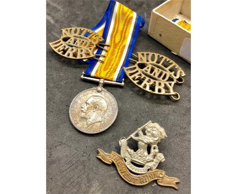 WW1 military items includes silver war medal to 22040 pte merricks w.rid .r ,2 notts and 2 notts and derby shoulder titles et