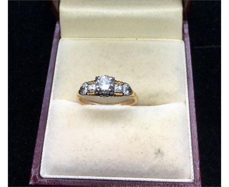 Vintage 18ct Gold Diamond ring centre stone measures approx 5mm dia set with 3 small diamonds each side 