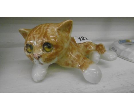 A WINSTANLEY CERAMIC CAT FIGURE WITH GLASS EYES